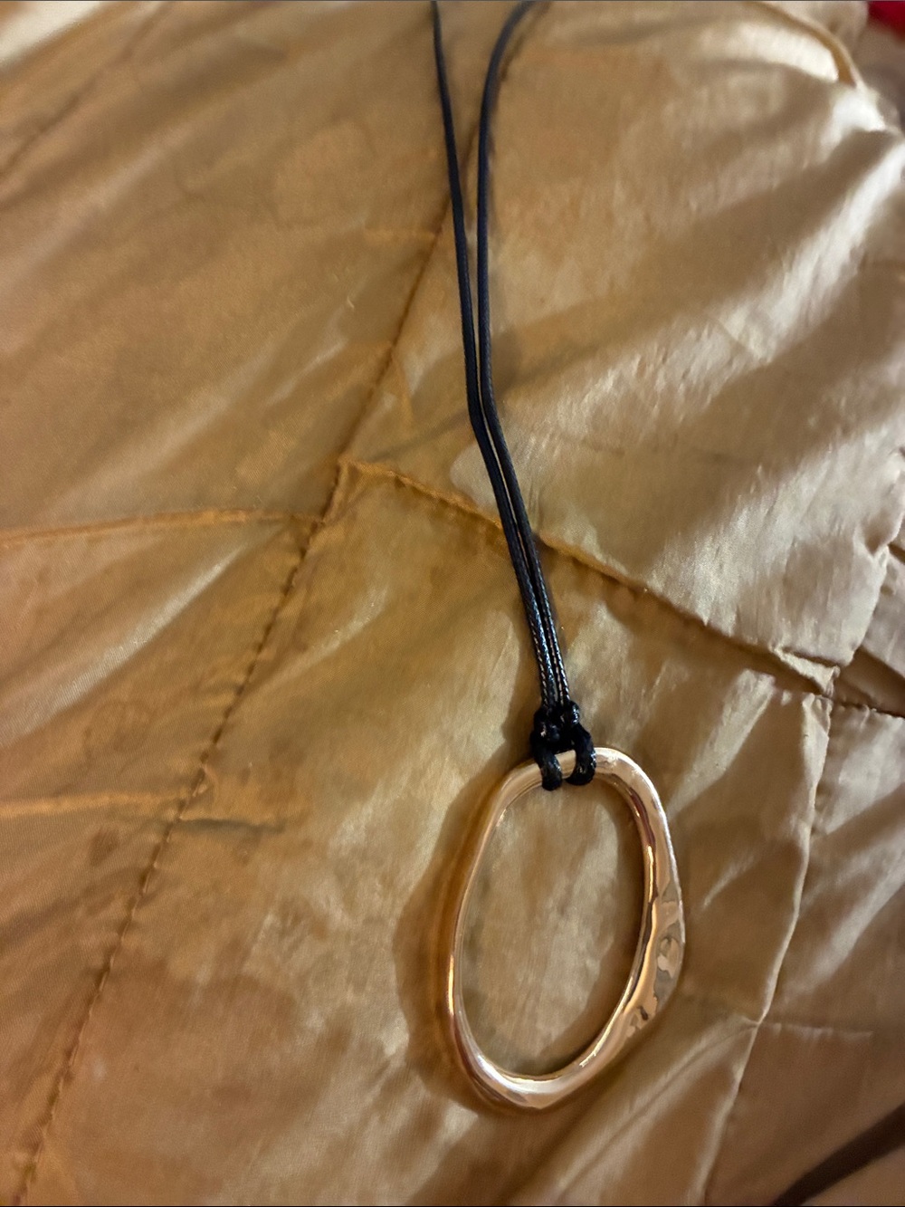 Gold-Tone Oval Pendant Necklace on Black Cord